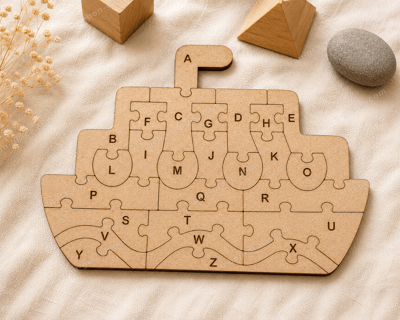 An alphabet jigsaw board, cut and sanded by hand